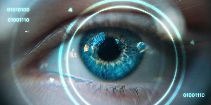 A closeup of a human eye with glowing rings superimposed in front of it