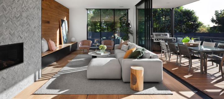 A modern interior living space, tastefully appointed with, plants, furniture, and wood and tile textures
