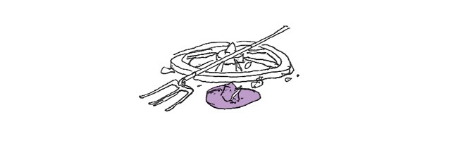 A pitchfork, wagon wheel, and hat, lying on the ground